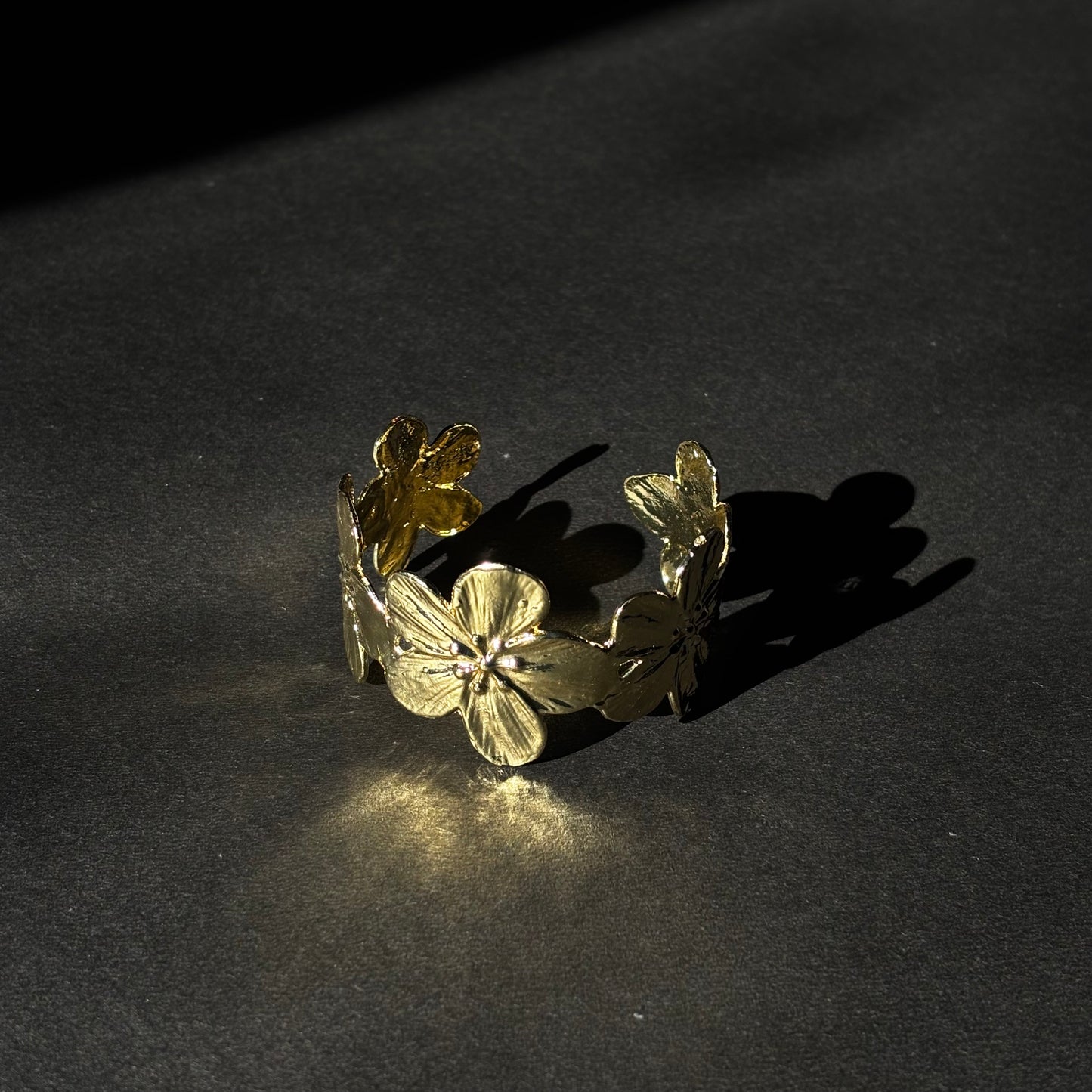 ROSIVAA Gold Textured Floral Cuff Bracelet